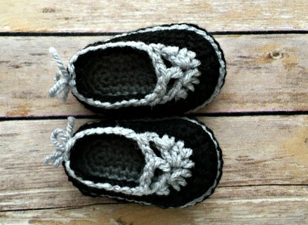 Black crochet Mary Janes with grey detail.
