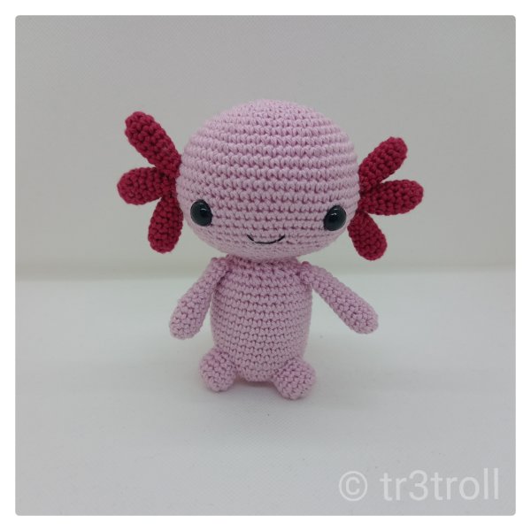 A mini axolotl amigurumi.