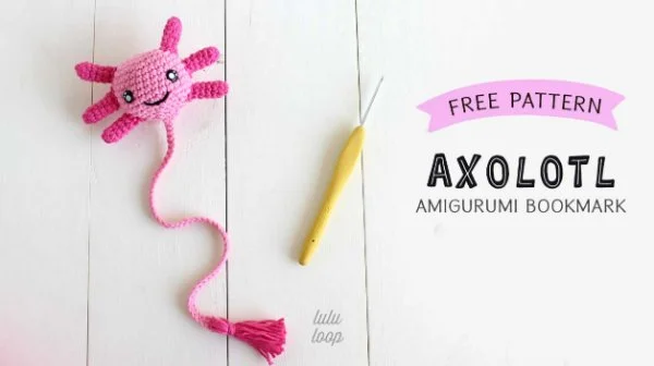 A crochet axolotl bookmark.