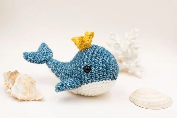 A small crochet whale and shells.