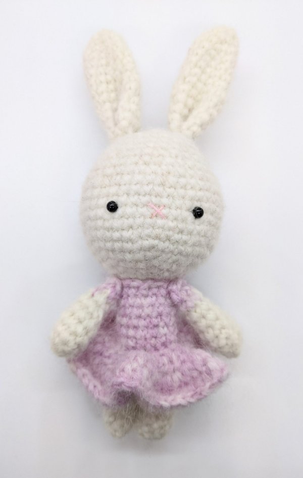 Crochet rabbit in a pink dress.