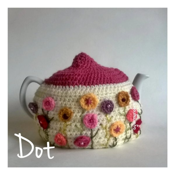 Crochet tea cozy on a teapot.