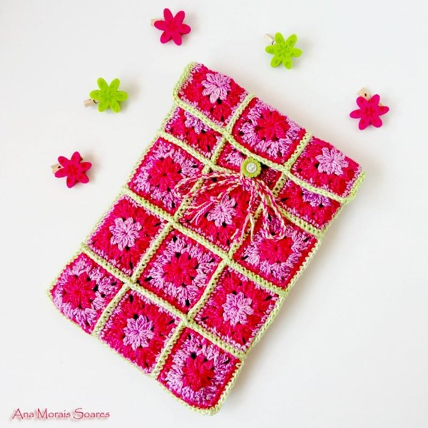 Granny square crochet tablet sleeve in red and pink.