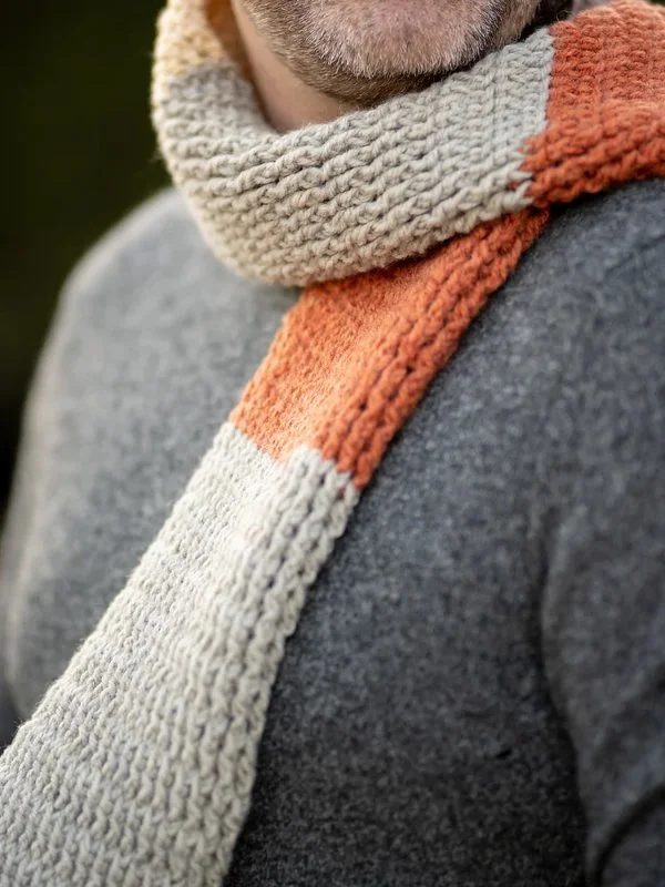 A close-up of a men's crochet scarf.