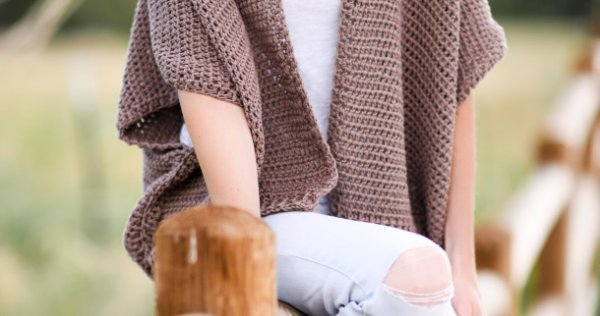 A brown crochet shrug.