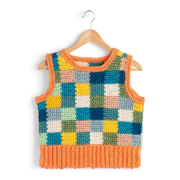A bright, multicolored crochet checkerboard sweater vest.