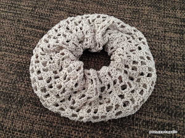 A filet crochet scrunchie.