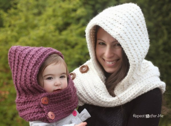 A woman and child with matching hooded crochet cowls.