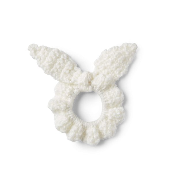 A white crochet scrunchie tie.