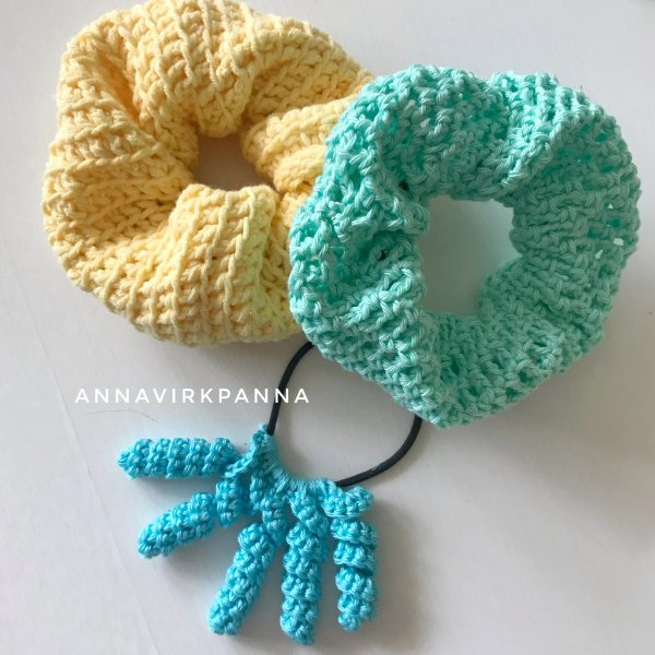 Three different styles of crochet scrunchies in bright pastels.