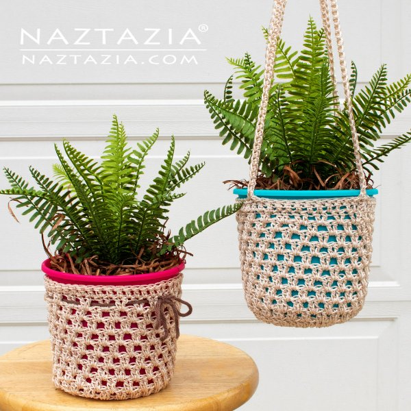 Two ferns in crochet plant covers.