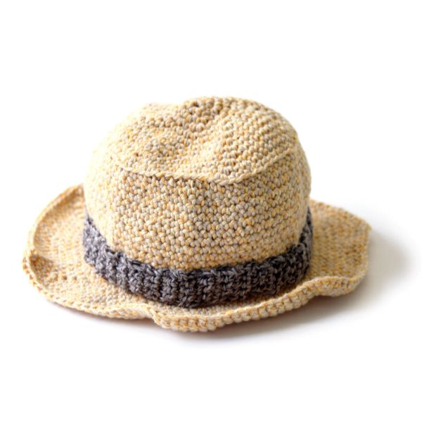 A child's crochet sun hat on a white background.