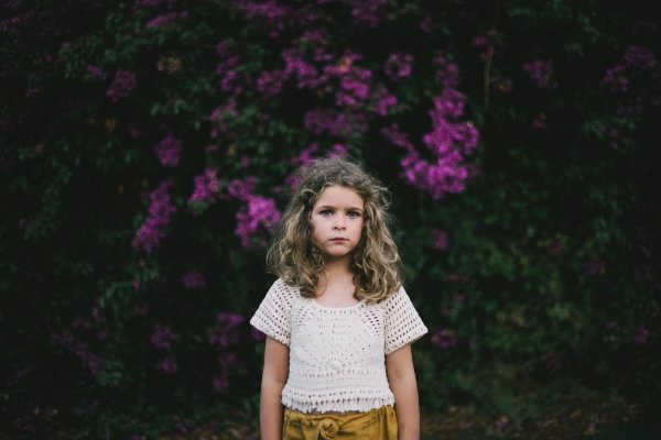 Child wearing a cropped crochet t-shirt.