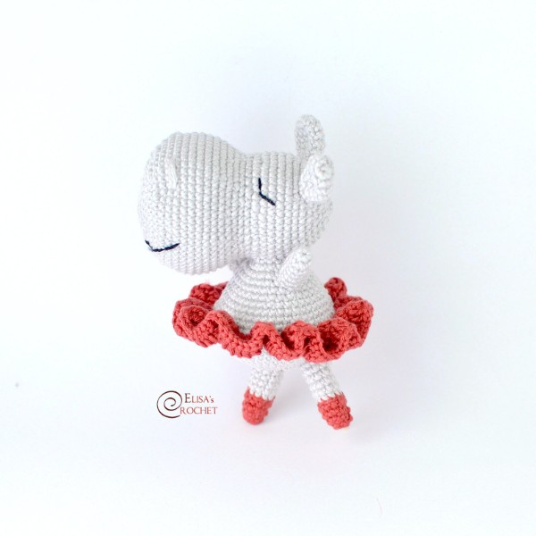 A crochet hippo doll in a ballerina tutu.