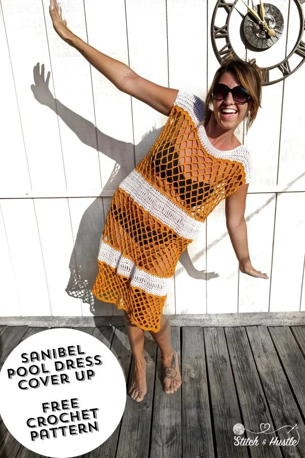 A woman wearing an orange and white stroped corchet pool cover-up.