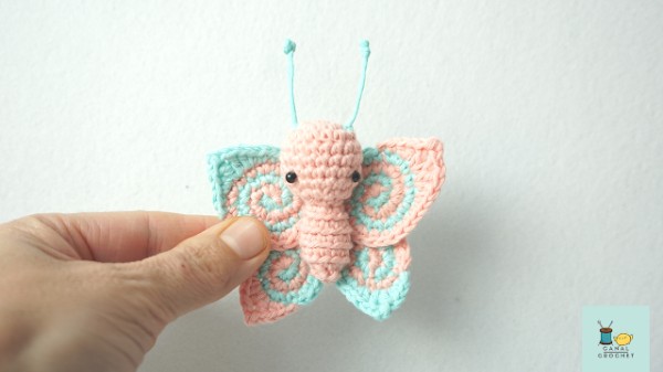 A small crochet butterfly amigurumi.
