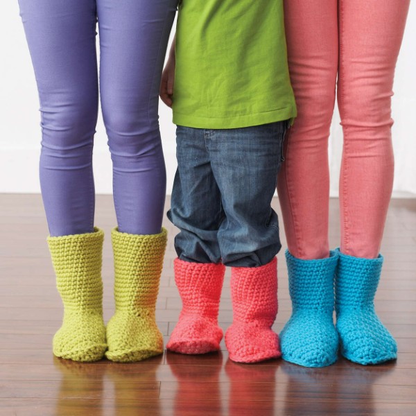 Children wearing kids crochet slipper boots.