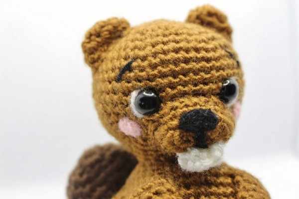 A close-up of a crochet beaver.