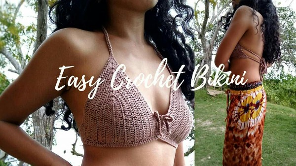 A closeup of a woman weraing a brown coloured crochet bralette.