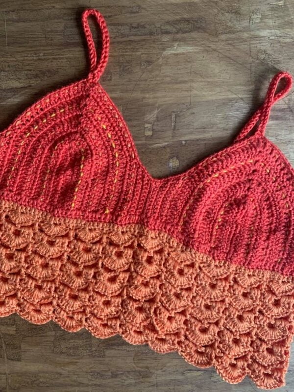 An oragne and red longline crochet bralette.