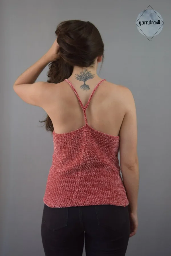 A back view of a woman wearing a racerback crochet tank top.