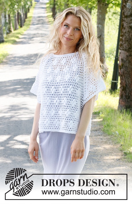 A woman with a mesh-style crochet lace tee.
