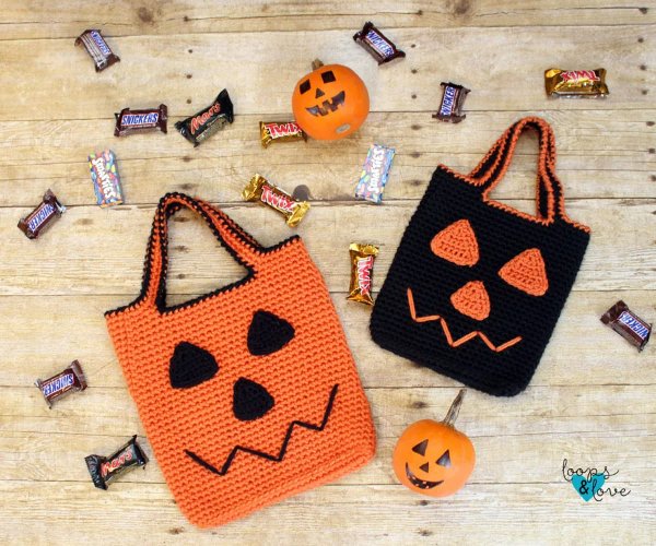 Two jack-o-lantern Halloween crochet bags.