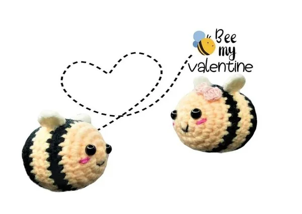 Two little crochet bees with rosy cheeks.