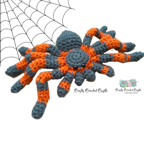 An orange and black striped crochet spider.