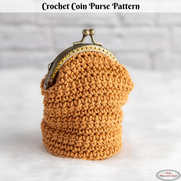 A deep crochet coin purse with a kiss clasp closure.