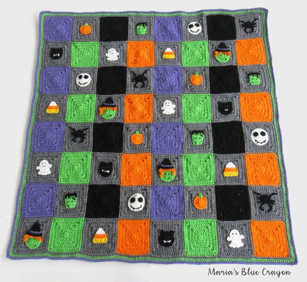 A Halloween-themed granny square blanket.