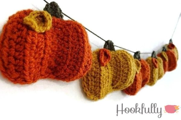 A closeup of a crochet pumpkin bunting.