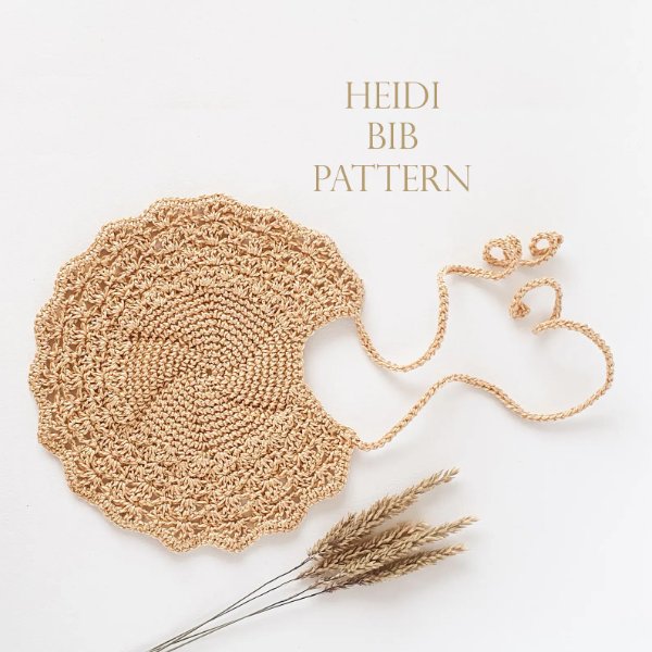 A neutral-coloured , special occasion crochet bib.