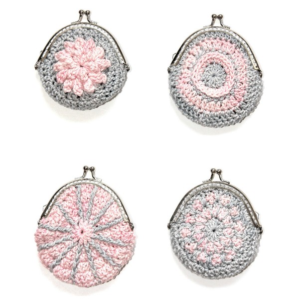 Four pink and grey crochet coin purses on a white background.