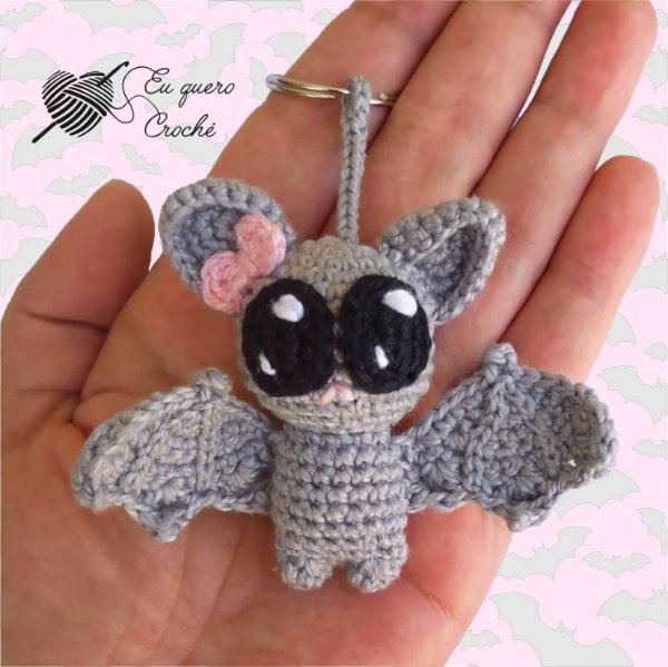A crochet bat keychain with nbig eyes.
