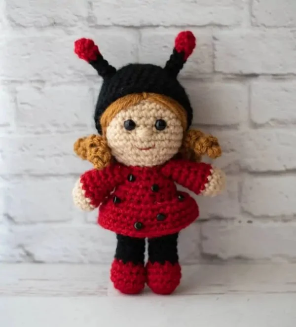 A crochet ladybug doll.