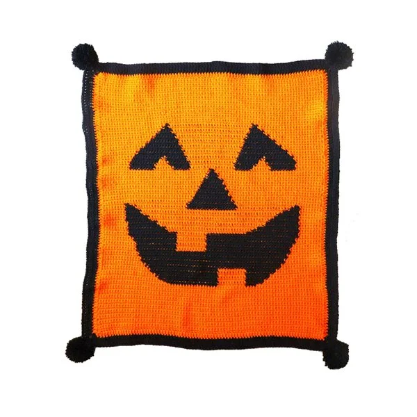 An orange Jack-o-lantern crochet blanket.
