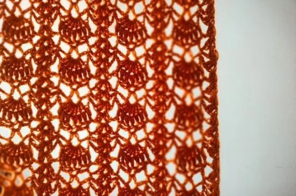 A lacy shell stitch crochet scarf.
