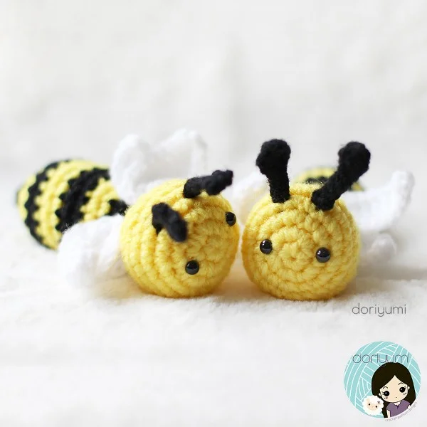 Two crochet bees on a white background.