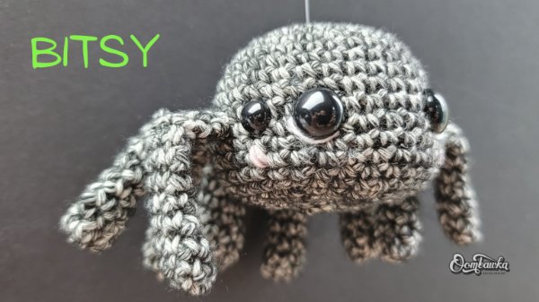 A cute and chubby grey crochet spider.