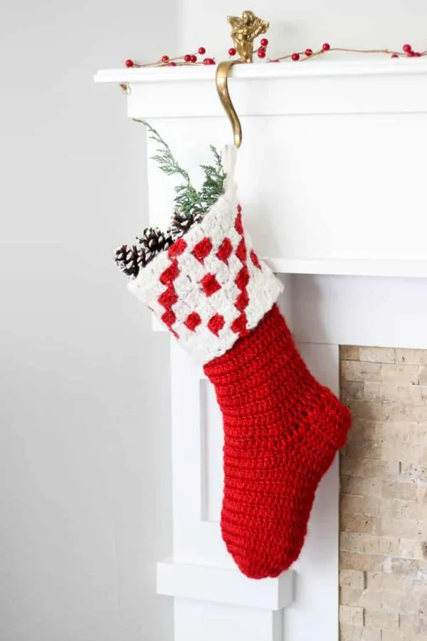 A festive red and white Christmas stocking with a C2C crochet cuff.