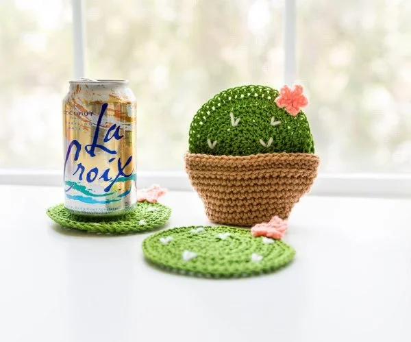 Green, cactus-themed crochet coasters.