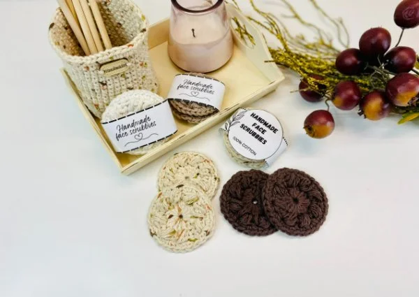Crochet face scrubbies and a timber tray and candle.