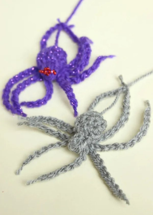 Crochet spiders with long legs and red eyes.