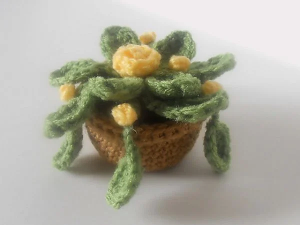 A mini crochet plant in a pot.