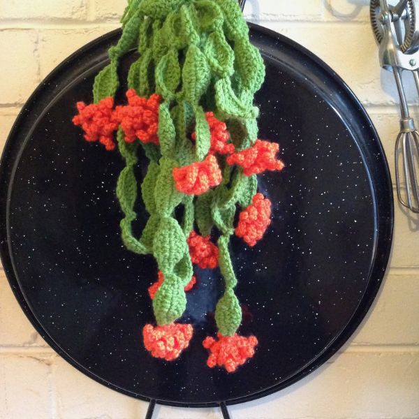 A crochet zygocactus in flower.