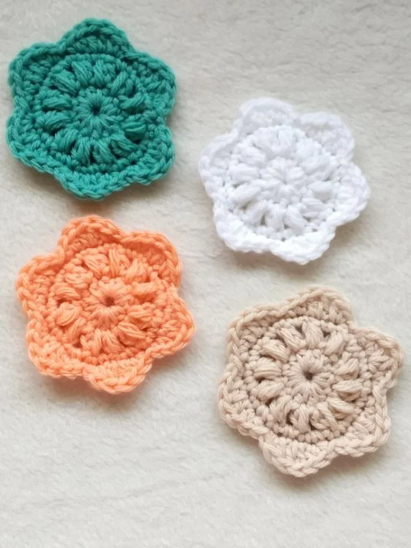 Crochet face scrubbies with scalloped edging.