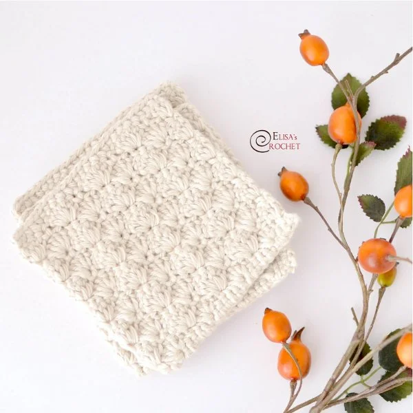 White crochet coasters with a textured stitch pattern