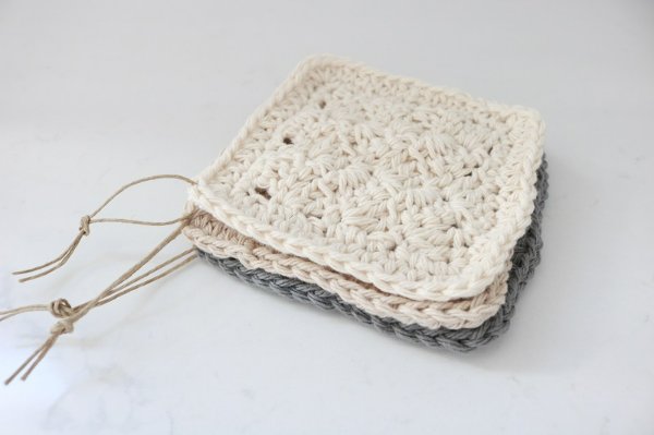 A stack of mini crochet washcloths.