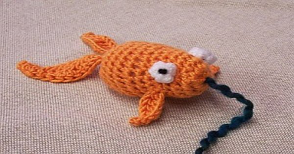 A crochet goldfish cat toy.